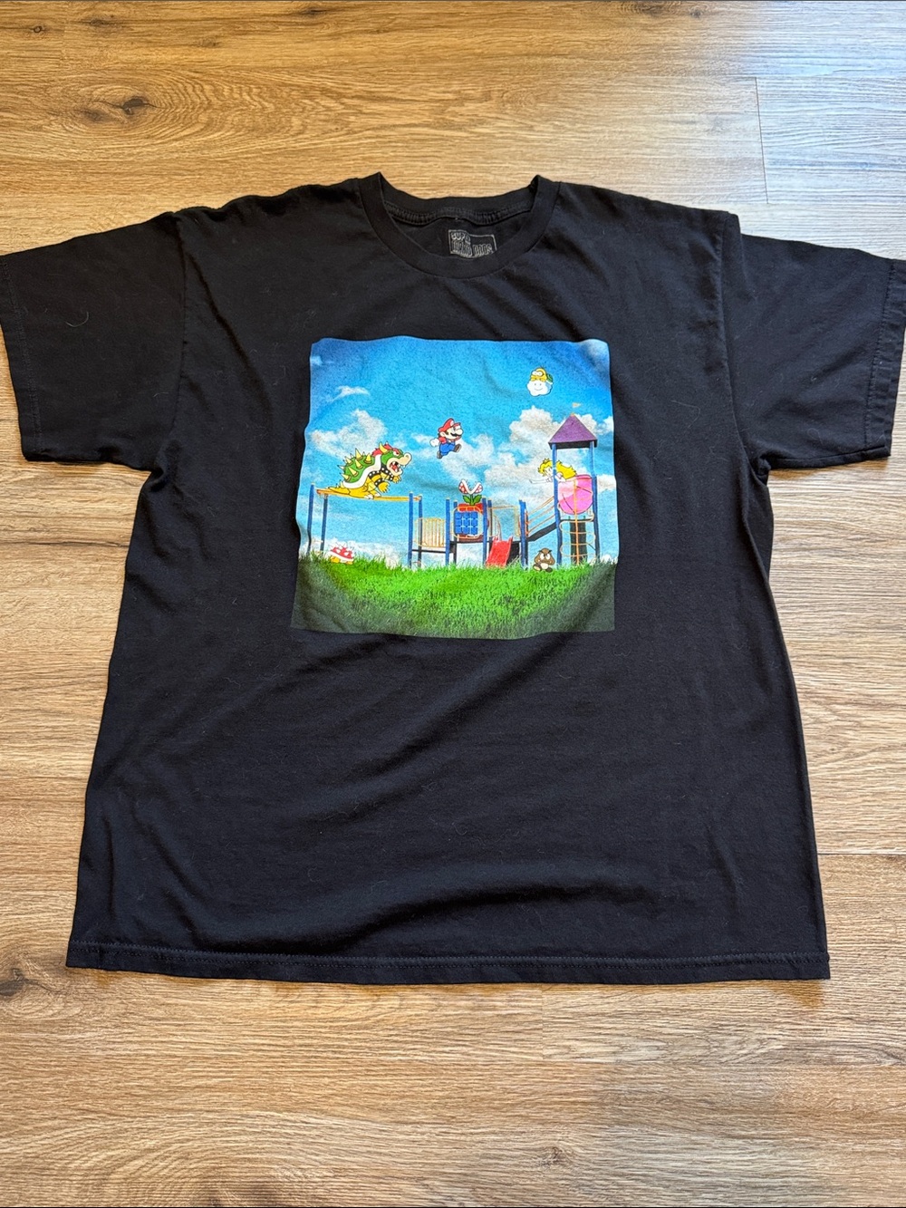 Black Men’s Graphic Tee with Colorful Playground Mario Scene Size XL